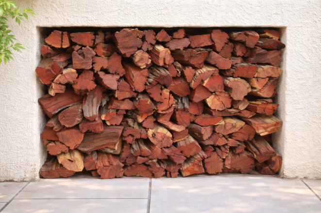 Bulk Kameeldoring firewood delivery in Cape Town by Mother City Firewood, showing high-quality dark red logs for long-burning braai fires.